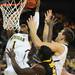 Michigan freshman Glenn Robinson III takes the ball to the hoop over freshman Mitch McGary and Iowa freshman Anthony Clemmons during the first half against Iowa at Crisler Center on Sunday, Jan. 6. Michigan beat Iowa 95-67 in the Big Ten home opener. Melanie Maxwell I AnnArbor.com